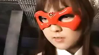 Young Asian heroine in an orange mask is taken down in a fi
