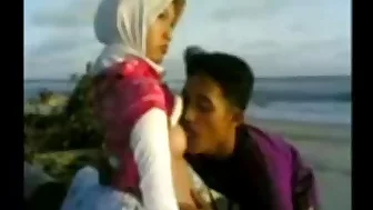 Indonesian- hijab girl fucks on the beach