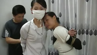 Two Chinese Girls Tied, One Wearing Cloth Mask