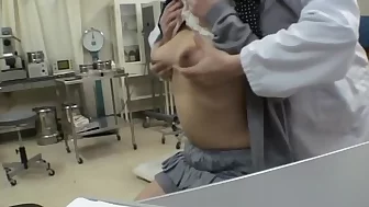 Busty doc screws her Jap patient in a medical fetish video